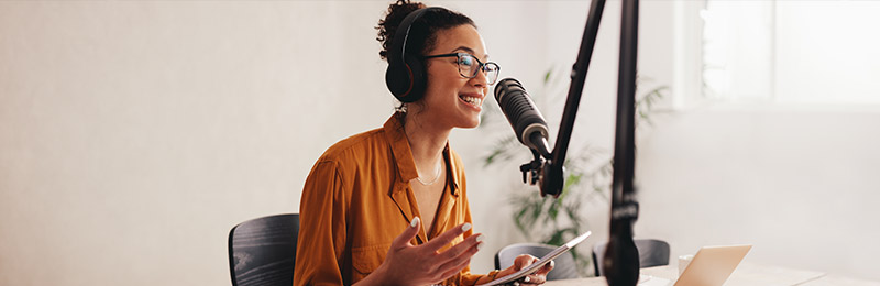 Woman speaking into microphone