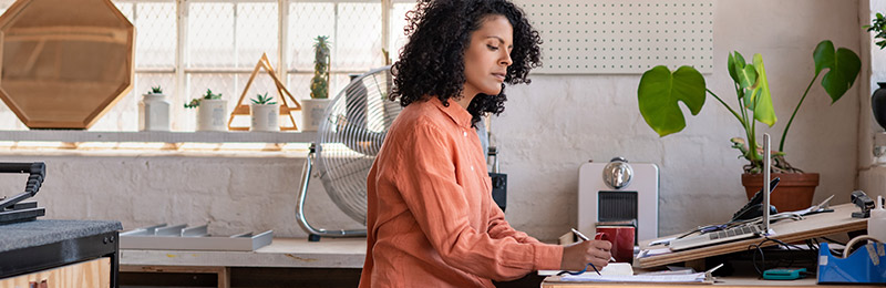 Woman working at drafting table