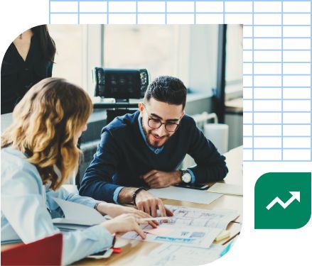 Employees working at desk with paperwork